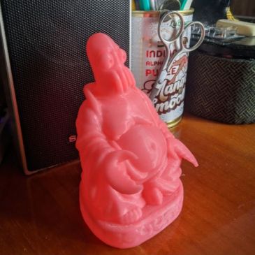 Zoidberg Buddha in red on table