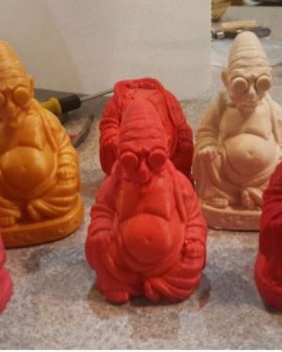 Professor Farnsworth Buddha busts on desk